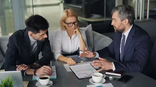Executives reviewing documents together