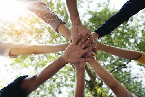Hands joined together in a circle